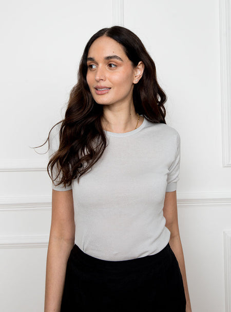 Women wearing a cloud grey short sleeved knit top in a luxury and premium sea island cotton material.